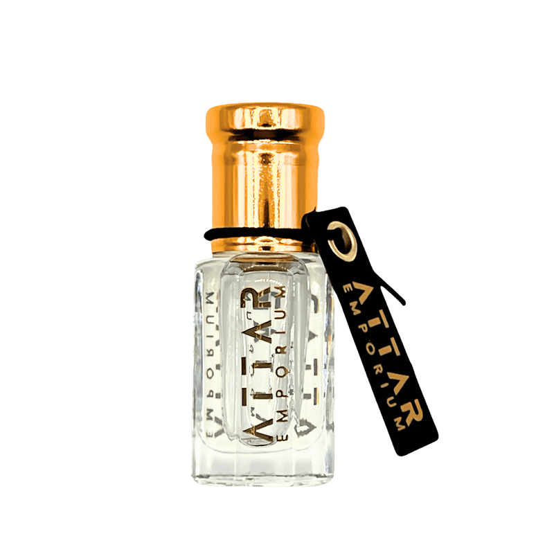 White Oud Attar Fragrance Oil in a luxurious glass bottle with a golden cap and elegant branding.